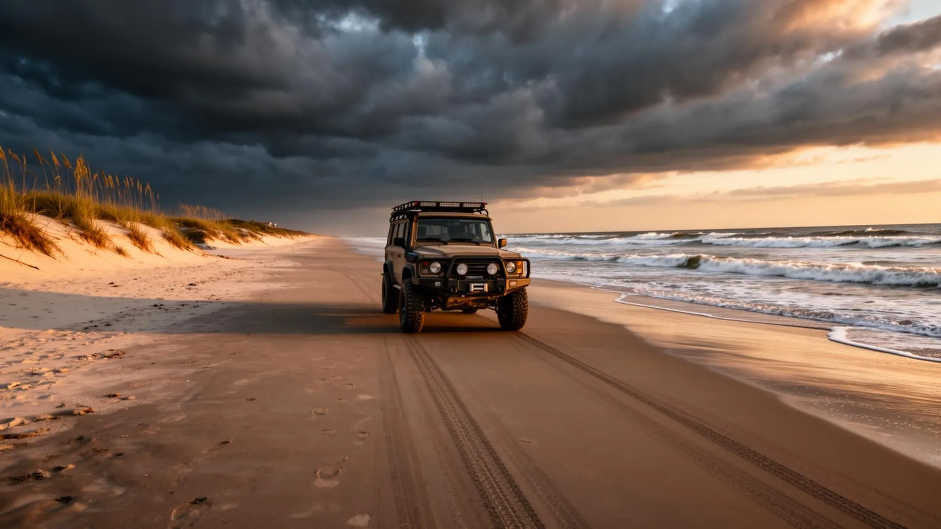 4x4 SUV driving on empty Carova Beach at sunset