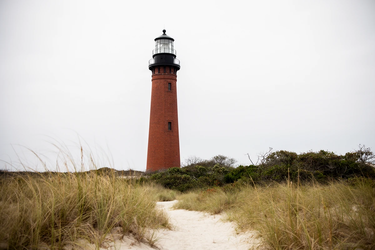 Currituck Beach Lighthouse, an unpainted red-brick tower in Corolla, North Carolina